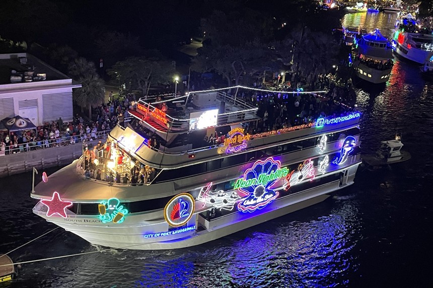 A yacht decorated in neon lights for the Winterfest Boat Parade in Fort Lauderdale