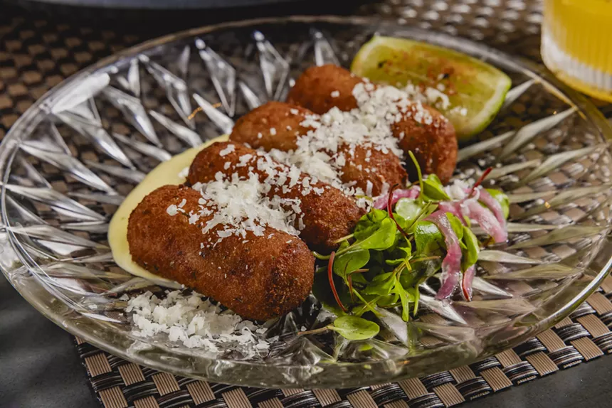 The croquetas served at Social 27 Supper Club in Little Havana are topped with cheese.