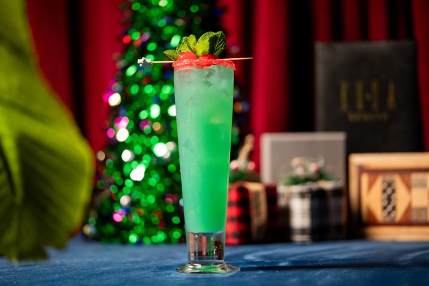 Kuba Cabana's Grinch-themed cocktail is talk and green with a hint of red for the holidays