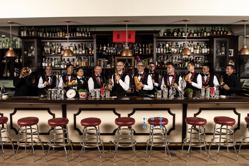 Cafe La Trova's bar lined with bartenders