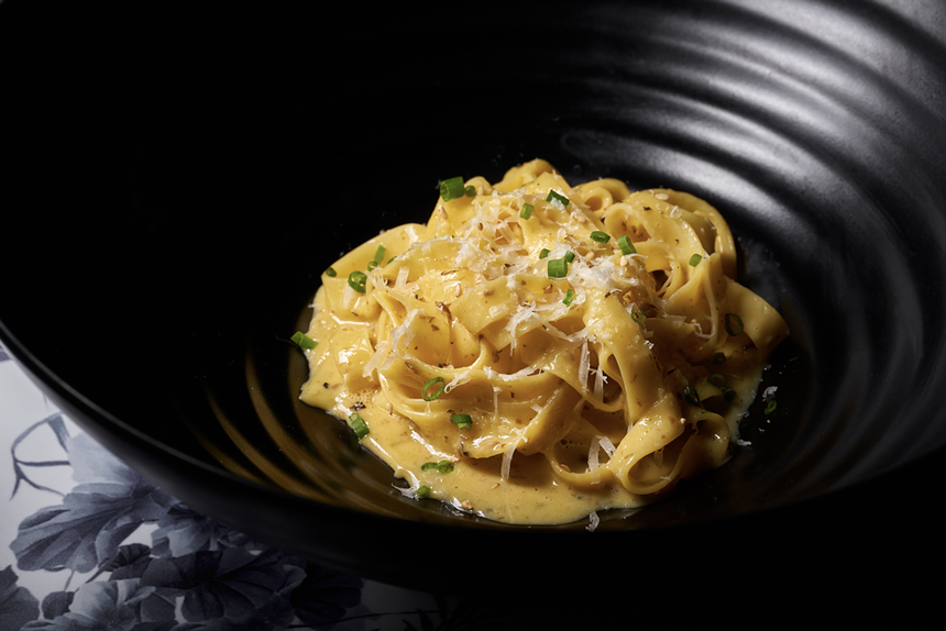 Photo of udon carbonara with jidori egg yolk and black truffle at Oise Ristorante in Wynwood.