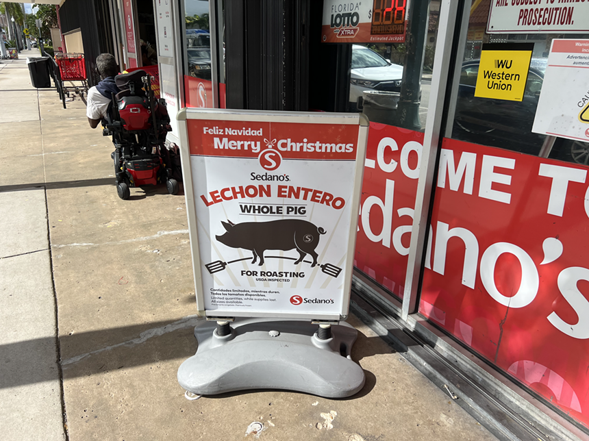 A sign promoting Sedano's "lechon entero" for Nochebuena and Christmas