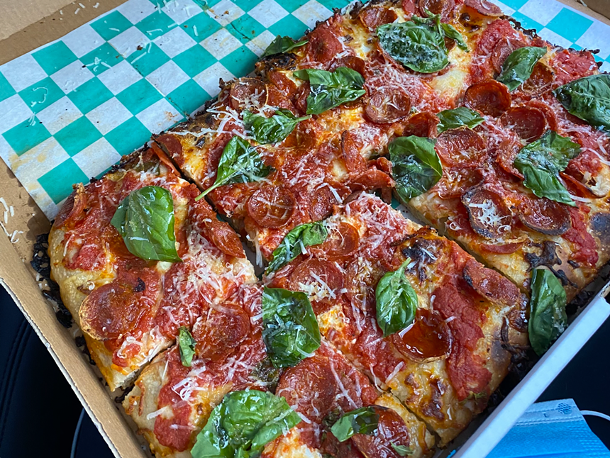 Old Greg's Pizza's "O.G. Roni" pie. A mask is seen in the bottom right corner.