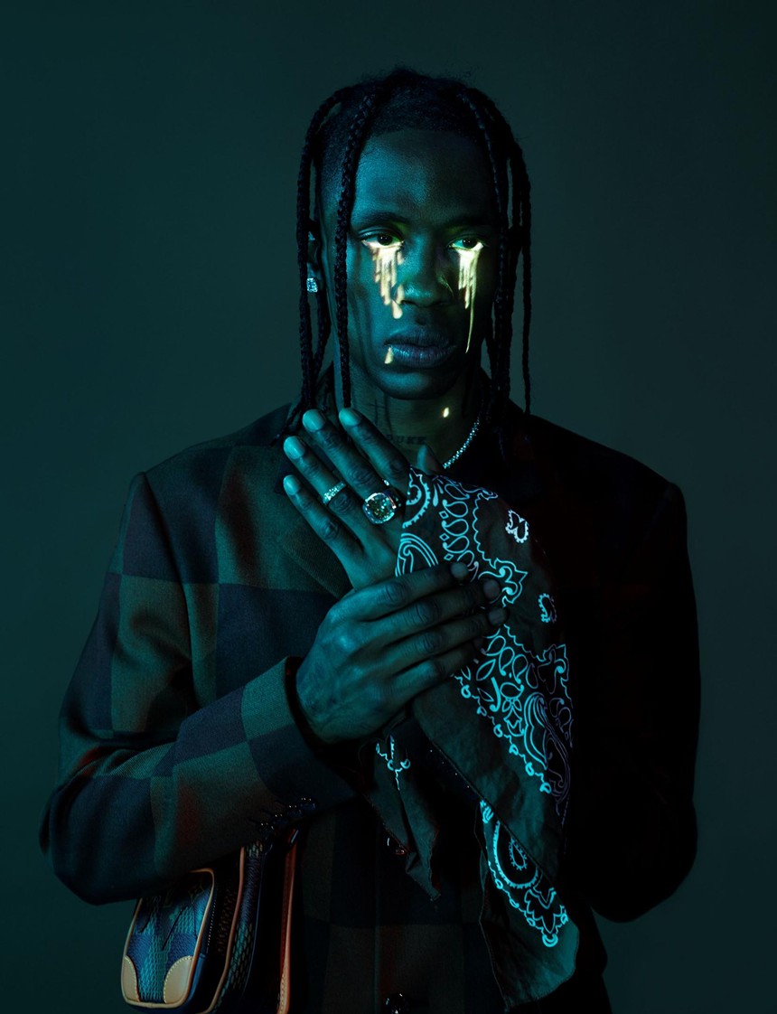 A photographer of Travis Scott with fluorescent tears dripping down his face