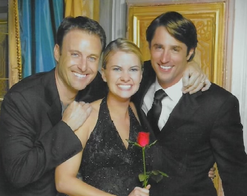 Three people smiling with a rose