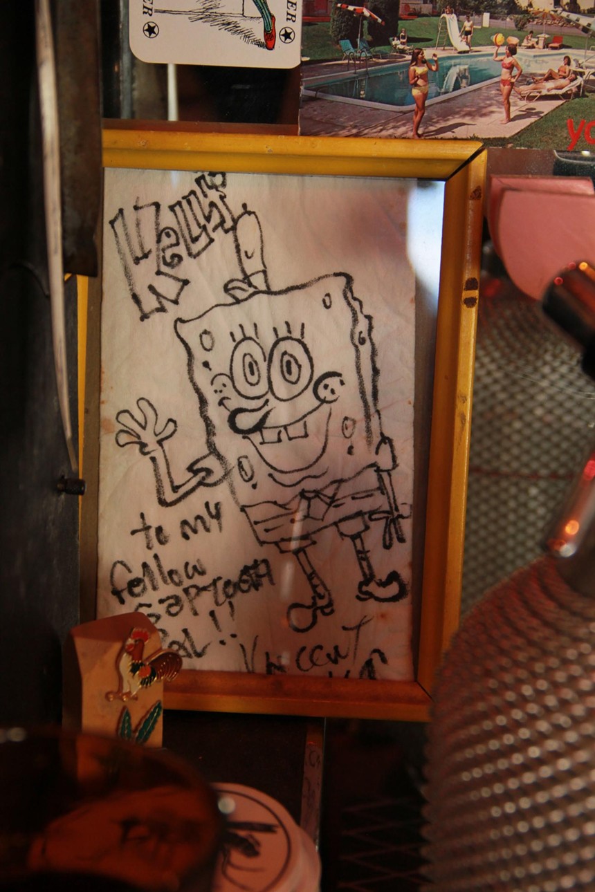 A framed drawing of SpongeBob on a napkin