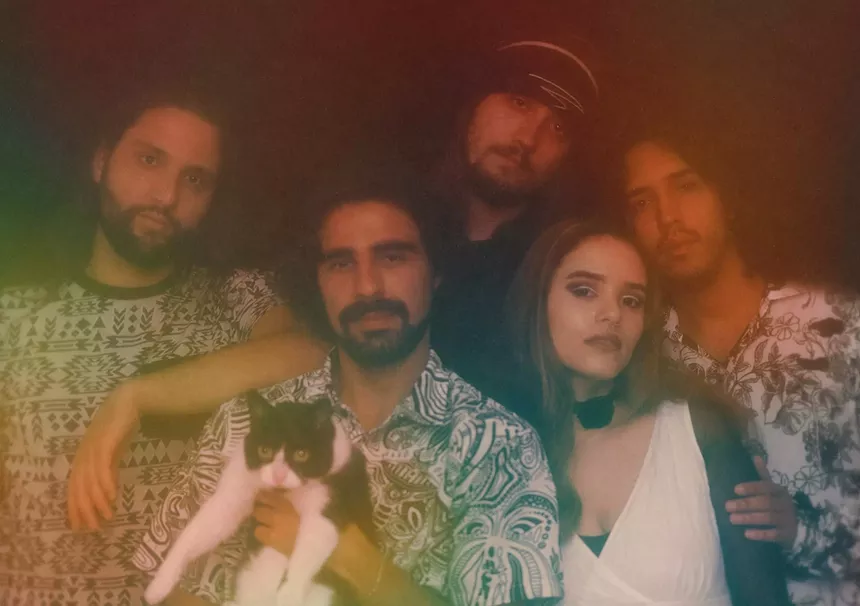 The five members of Flower Child Slumber Party and a cat