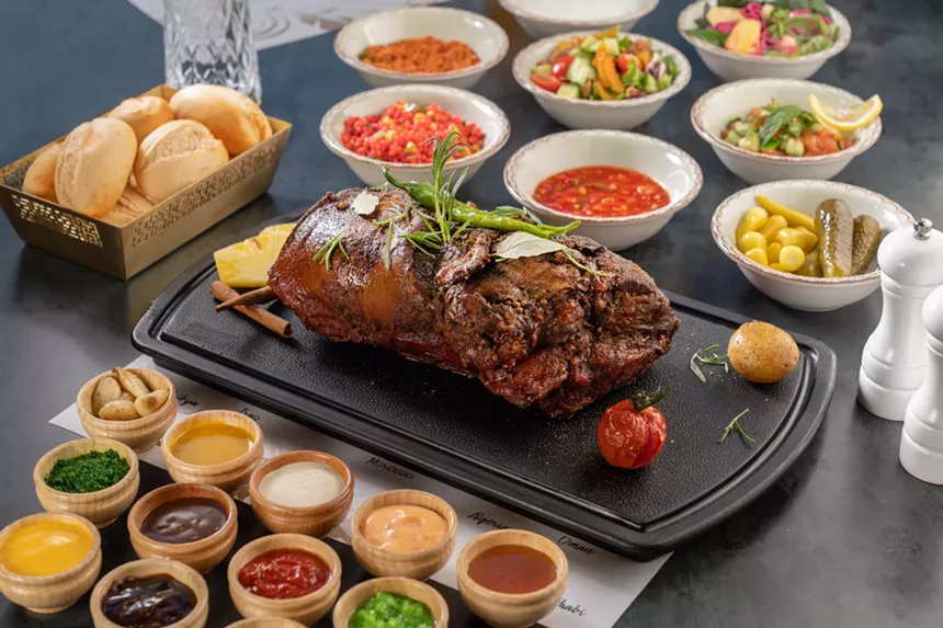 Meat and sauces on plates