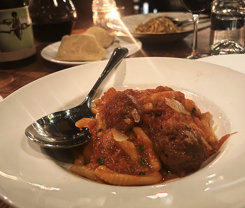 A closeup of pasta in a white bowl