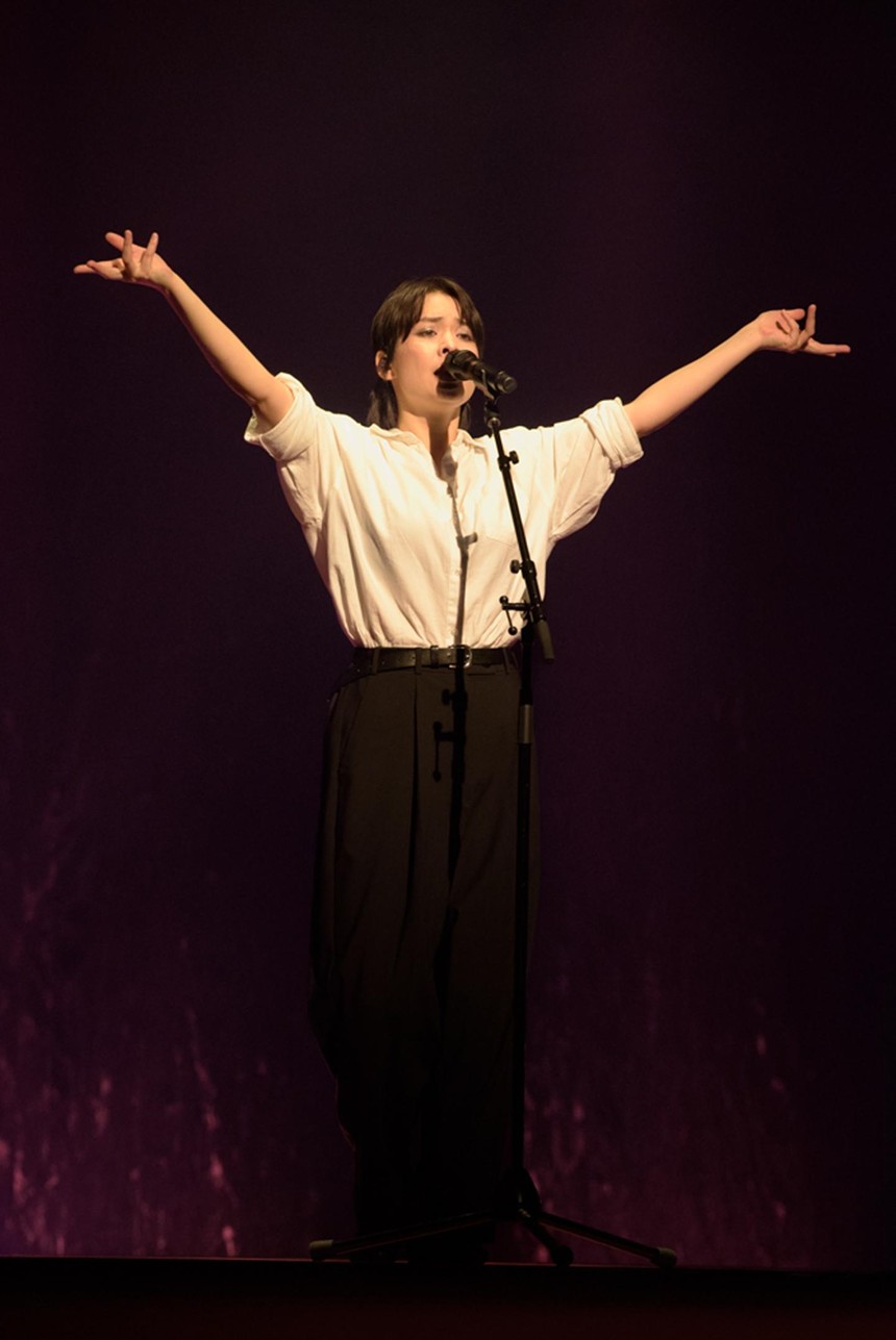 Mitski performing on stage