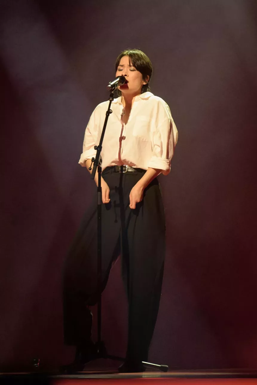 Mitski performing on stage