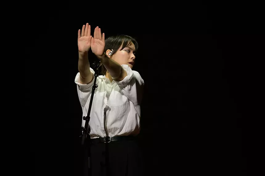 Mitski performing on stage