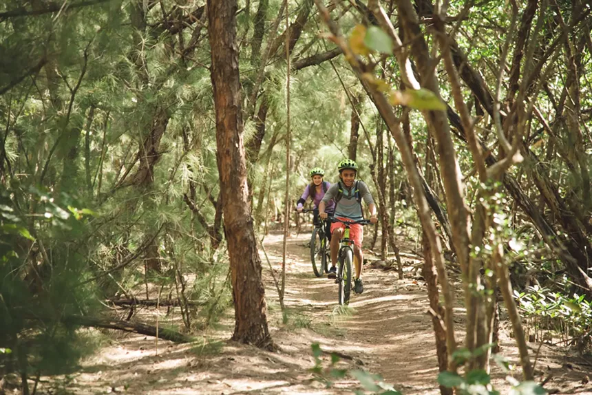 Two people on a bike trail
