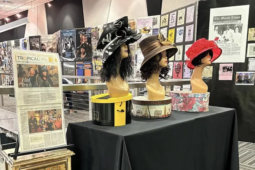 Newspaper clips, costumes, and other ephemera in the M Ensemble's "Golden Years" exhibition