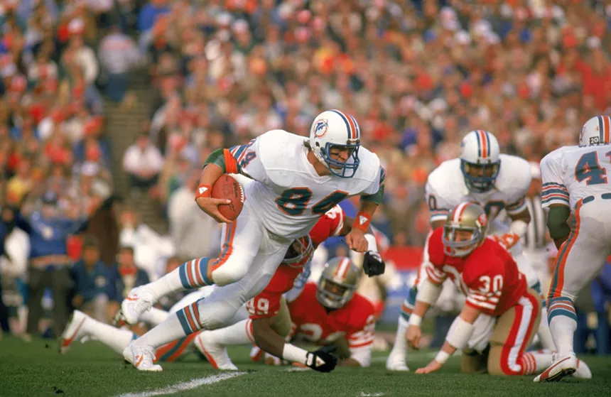Miami Dolphins player Bruce Hardy running against the San Francisco 49ers