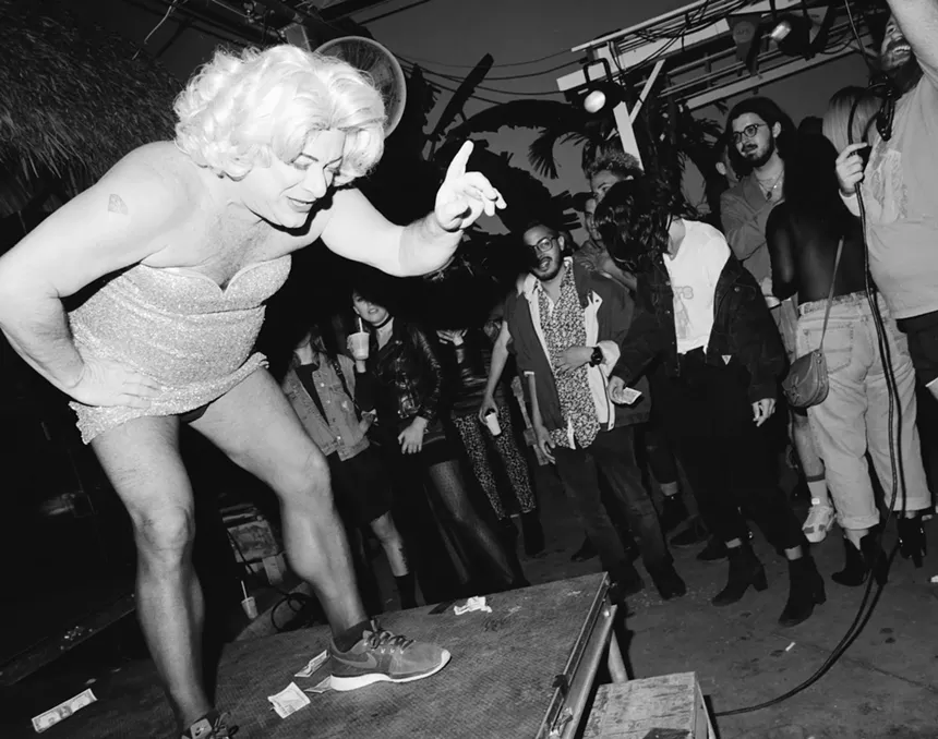 Shelley Novak hunched over on stage at Gramps