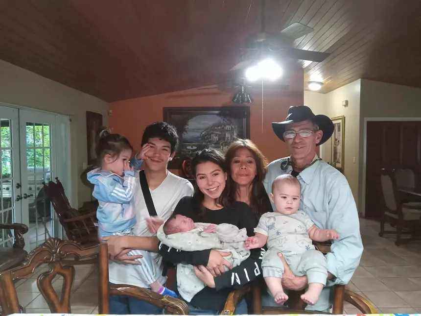 The Cueli family pose for a picture
