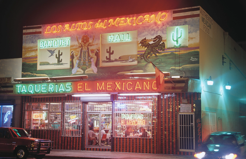 A vintage neon sign on a restaurant