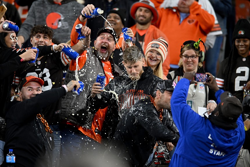 Fans pour beer on a man in the stands of Cleveland Browns game