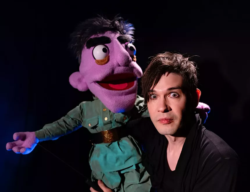 Timur Bekbosunov holding a puppet
