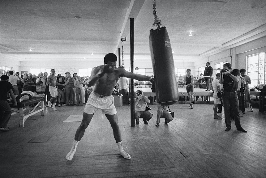 Muhammad Ali practicing with a punching bag