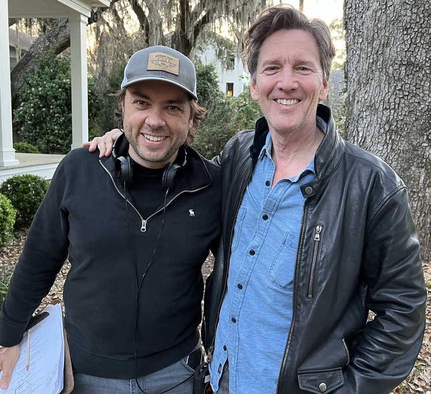 Damian Romay and actor Andrew McCarthy smile at the camera