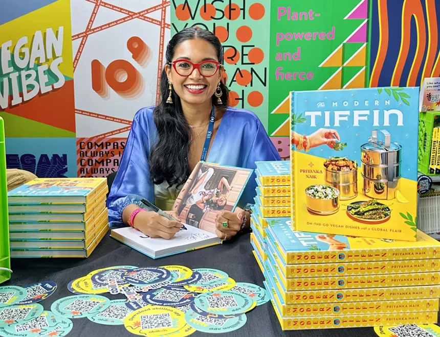 A woman signing books