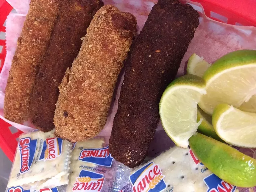 Croquetas next to limes