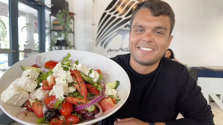 A man holding a plate of food