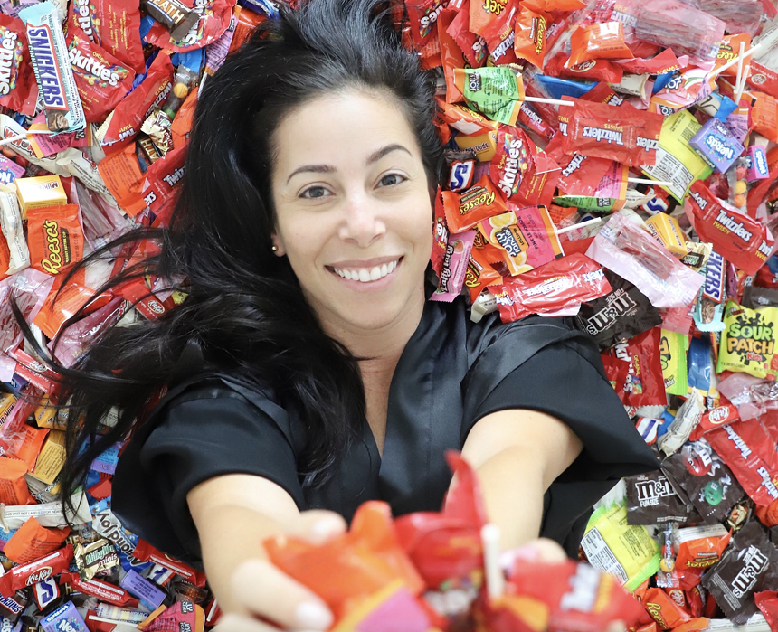 A woman surrounded by candy