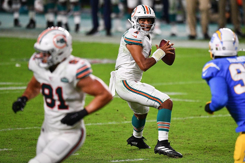 Miami Dolphins quarterback Tua Tagovailoa winds up to throw a touchdown pass