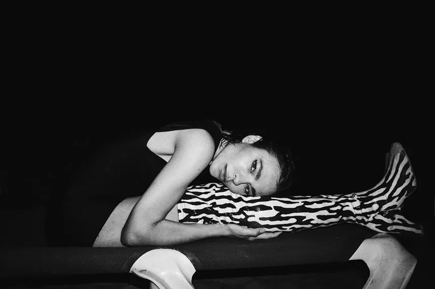 Nina Kraviz bend over hugging her legs