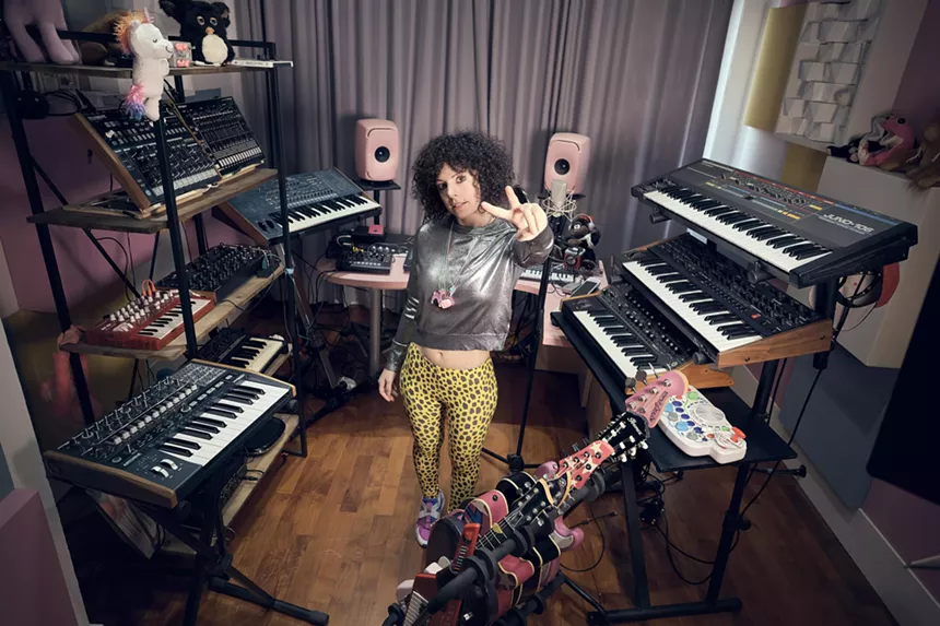 Giorgia Angiuli surrounded by keyboards