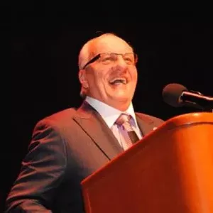 Pembroke Pines' mayor smiles in front of a large podium