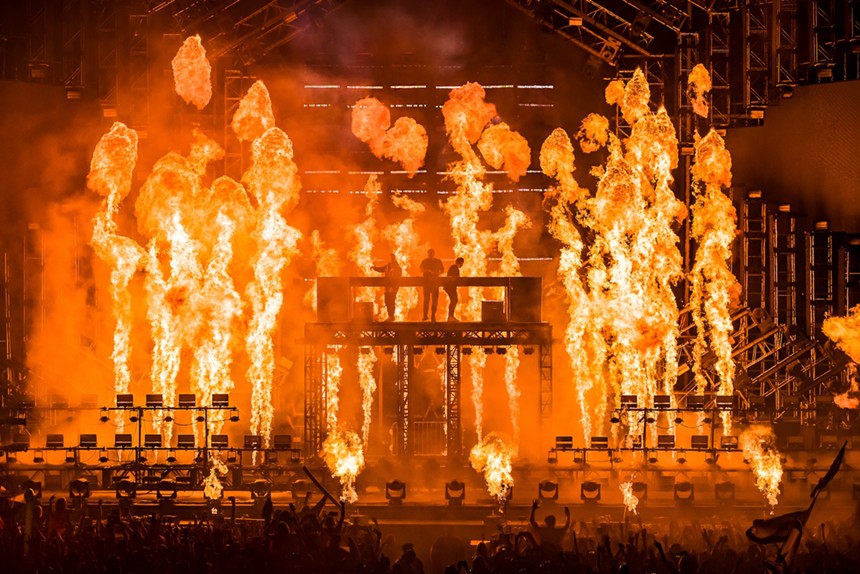 The three members of Swedish House Mafia on Ultra's main stage as pyrotechnics go off