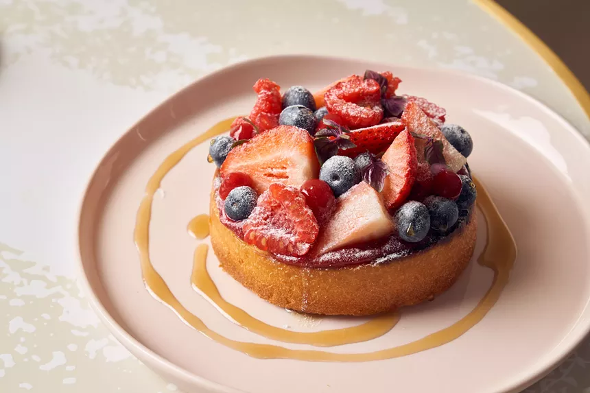 A dessert with berries on a plate