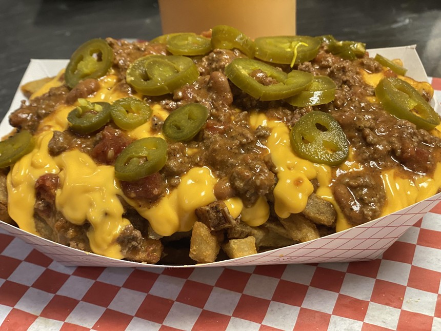 A loaded fries with toppings dish