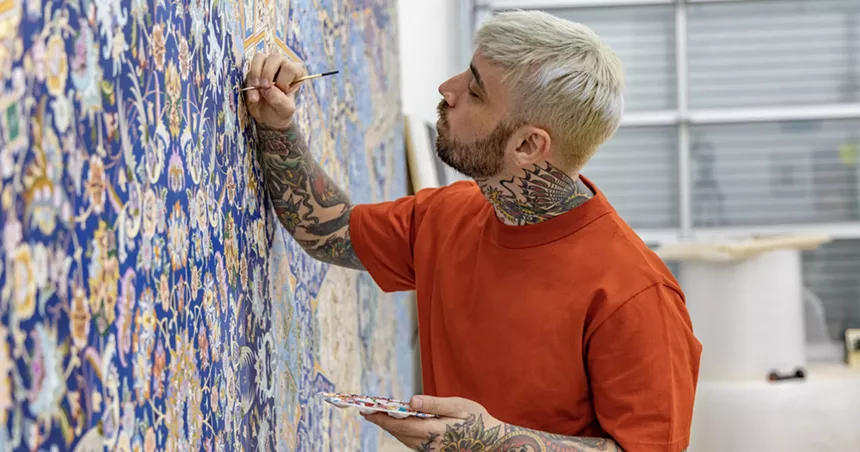 Jason Seife painting in his studio