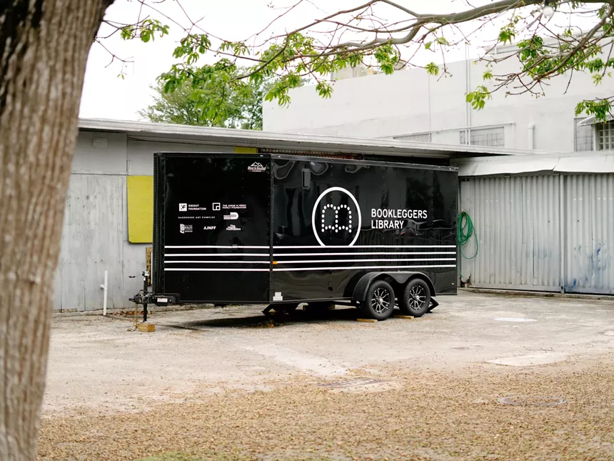 The Bookleggers Library parked in a yard