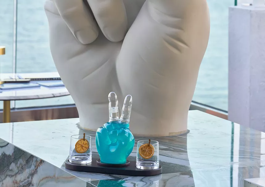 A hand sculpture and cocktails