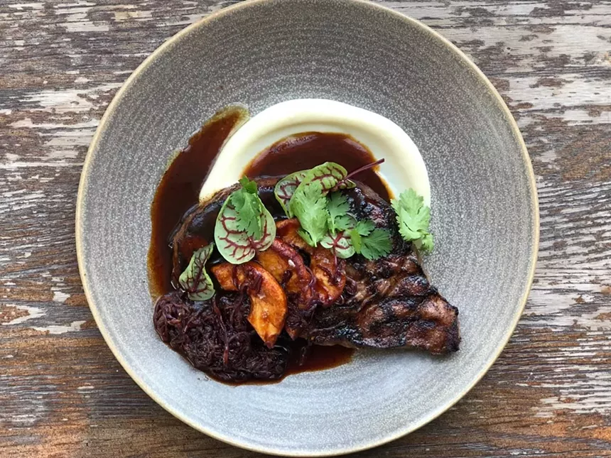 Steak dish on white plate