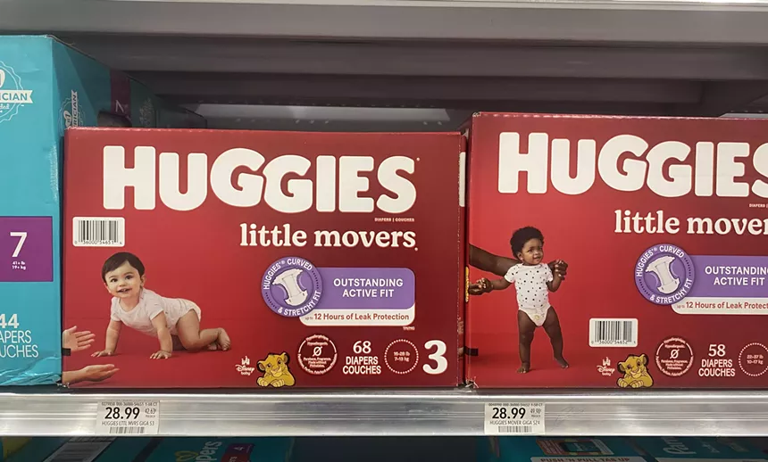 A row of diaper boxes for sale at a local grocery store