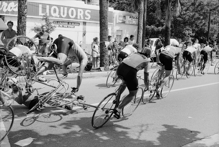 Black-and-white photography of cyclists in Miami's Coconut Grove neighborhood