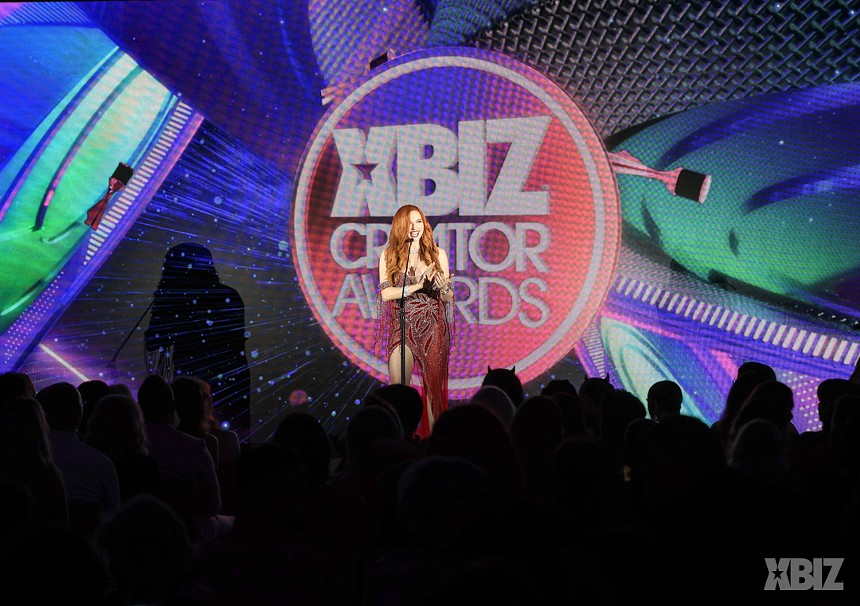 Amouranth accepting an award at the Xbiz creator awards