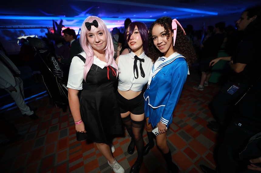 Three women cosplaying at OtakuFest in Miami