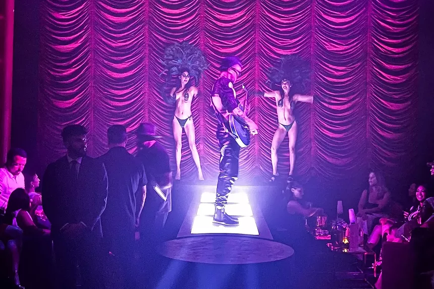 A guitarist on stage at the Faena Theater