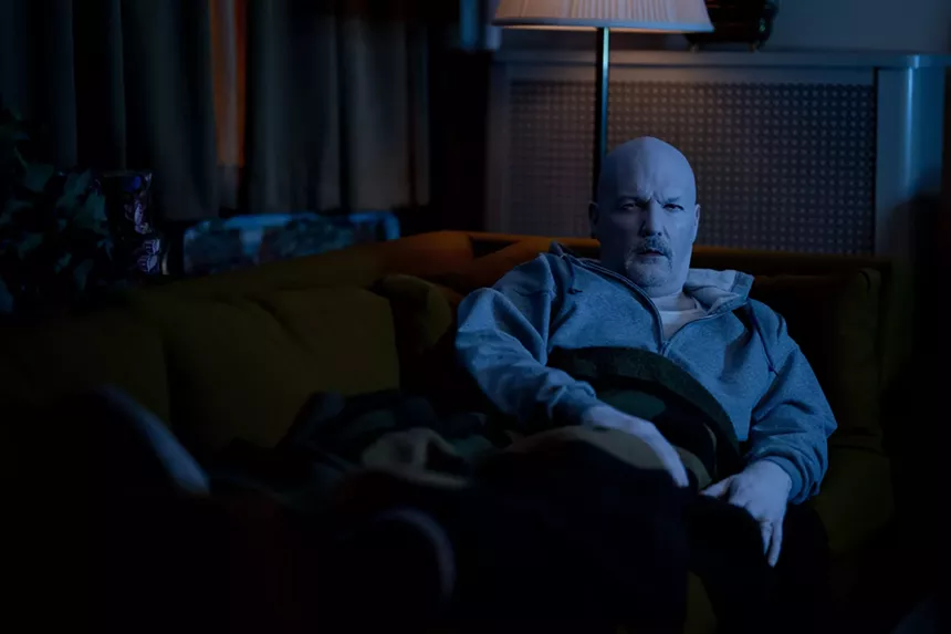 Fred Durst laying on the couch in I Saw the TV Glow