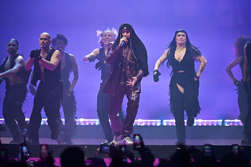 Bad Bunny and his backup dancers on stage at the Kaseya Center