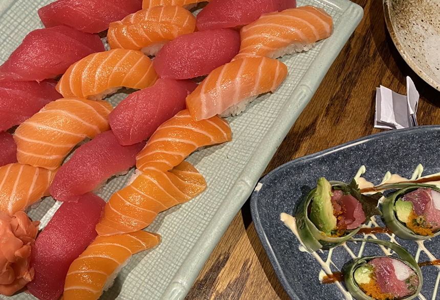 Rolls of colorful nigiri next to sushi rolls