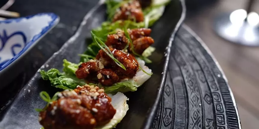 Meat dishes on a black serving board